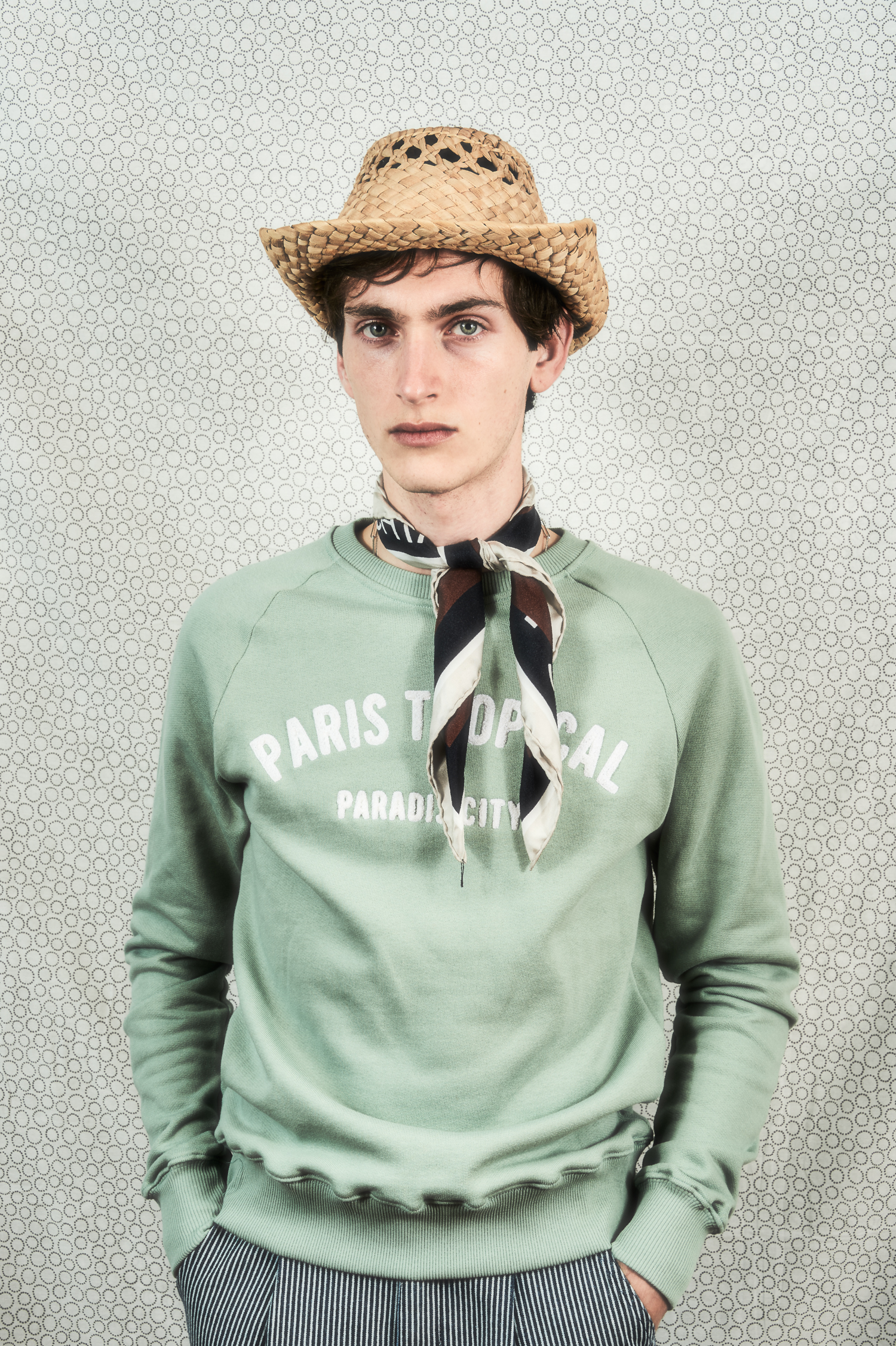"boy with hat and silk scarf in light green sweat shirt"