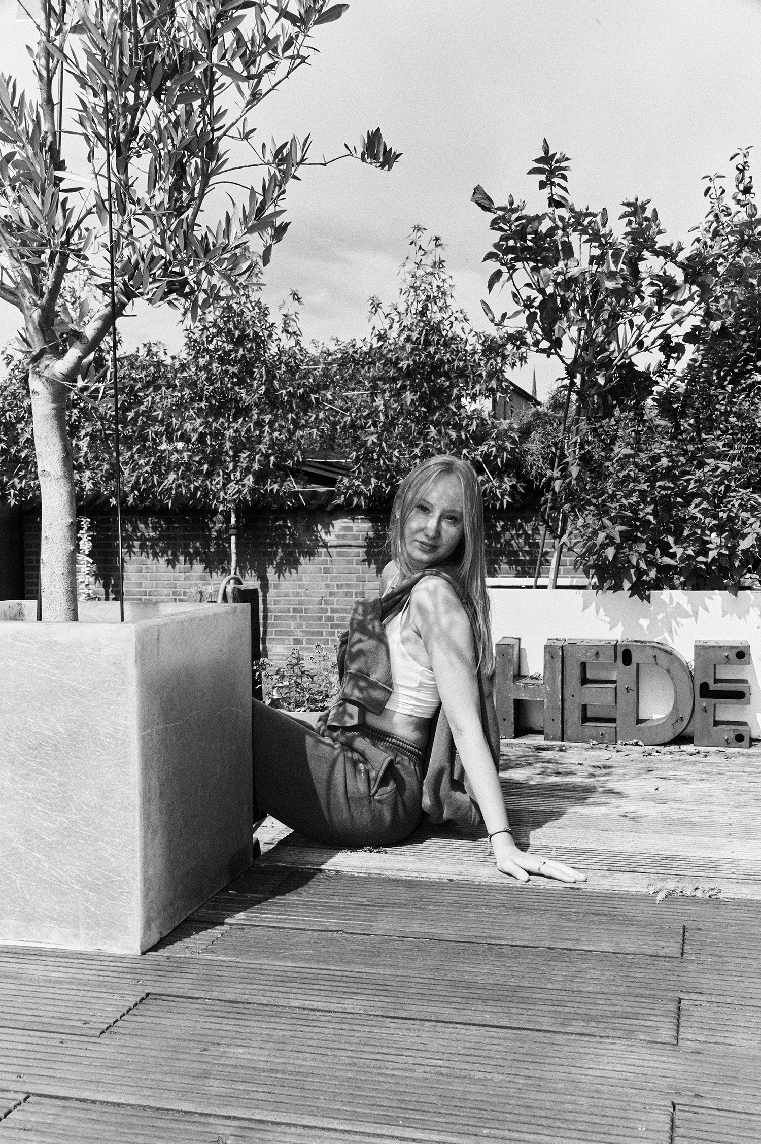 "portrait black and white of young girl Falke who loves yellow in Germany"