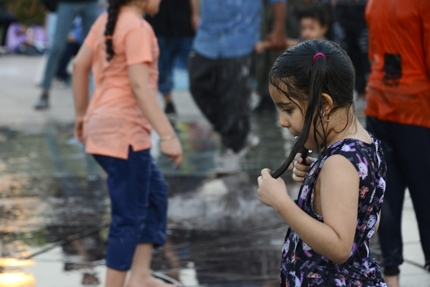 "Ab-o-Atash Park Tehran, Iran people enjoying water fountains"